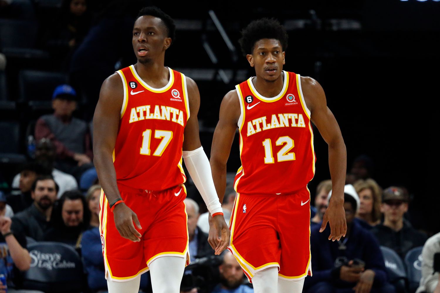 Hawks forwards Onyeka Okongwu and De'Andre Hunter walk up the court.
